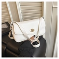 Close-up of white flip-top handbag with gold twist lock and a sleek textured finish - White