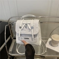 White mini backpack with floral embroidery, bow accent and heart-shaped metal charm - White