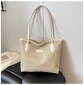 Detail of cream woven tote bag featuring dual slim shoulder straps and leather label - Off White