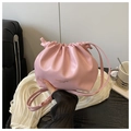 Detail view of pink pleated bucket bag with gold lettering and drawstring closure - No Pendant / Pink