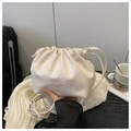 Detail of cream drawstring pleated bag with gold fashion lettering and thin strap - No Pendant / White