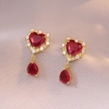 Golden heart and teardrop earrings with red crystals and zircon halo on velvet - Heart Earrings (E0651)