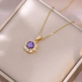 Elegant gold necklace featuring a purple floral zircon pendant with white accent stones - Necklace (X3868) / Purple