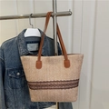 Woven straw tote bucket bag in beige with dark brown lace trim and leather handles - Khaki