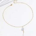 Detailed view of golden necklace with green stone bead and white pearl fringe pendants - Single Necklace (X3904)
