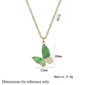 Elegant gold butterfly pendant necklace with green enamel wings and adjustable chain - Green Butterfly Necklace (X1971)