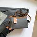 Contrast grey canvas crossbody bag with tan leather trim and matching shoulder strap - Black