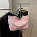 Borsa tote rosa in nylon impermeabile con manici bianchi e neri e tasche laterali - Grande / Rosa