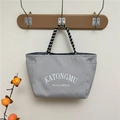 Gray nylon commuter tote bag with striped rope handles and printed letters - Gray