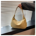 Detailed view of woven texture and hobo shape on light gold shoulder bag - Gold