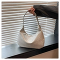 Macro detail of silver woven texture on a minimalist hobo bag with a sleek metallic finish - Silver