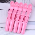Détail de 5 pinces à cheveux crocodile roses avec poignée antidérapante texturée - Rose