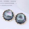Elegant 925 silver studs with iridescent resin inlay and hammered gold textured borders - Vintage Round / Black