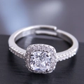 Macro shot of cushion-cut cubic zirconia ring with halo setting and adjustable silver band - Cushion Halo Style (No. 3)
