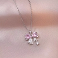 Elegant silver bow necklace featuring pink heart stones and a round white zircon pendant - Steel Heart Pink Gemstone Bowknot Style (X2945)