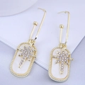 Detailed view of gold starburst earrings with sparkling rhinestones and white mother of pearl - Gold White Starburst Rectangle Drops (5#)