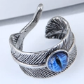 Macro shot of gothic feather texture and blue evil eye bead on an open ring - Blue Evil Eye Feather Style (3)