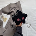 Mini ster-vormige crossbodytas in zwart met cartoongezicht en zilveren ketting - Zwart