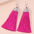 Detailed view of magenta silk fringe tassel earrings with vintage silver floral metal caps - Rose Red