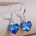 Detail of heart-shaped blue-purple crystal drop earrings with silver hooks - Blue