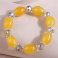 Detail of yellow oval beads and faceted crystal beads with silver flower spacers on bracelet - Bright Yellow (3)