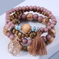 Bohemian meerlaagse elastische armband met houten kralen, levensboom en kwastje - koffiekleur