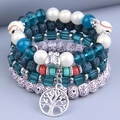 Bohemian multilayer beaded bracelet set featuring a Tree of Life charm and baseball beads - Blue