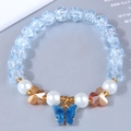 Detail of sweet butterfly pendant bracelet with light blue crackle beads and pearls - Blue (42538)