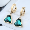 Macro shot of gold hoop earrings with heart-shaped green gemstones and polished finish - Gold + Green Heart (2031907)