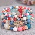 Multilayer beaded bracelet featuring colorful resin beads and a gold heart tree charm - Light Multicolor