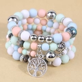 Multi-layer pastel bead bracelet featuring a tree of life pendant and silver accents - Colorful
