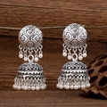 Vintage oxidized silver Jhumka earrings with intricate hollow carving and white pearls - Silver (150733197)