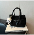Chic black woven handbag with silver buckle and white plush charm accessory - With Charm / Black