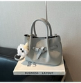 Gray woven handbag with decorative leather buckle and white plush monster charm - With Charm / Gray