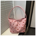 Dettaglio della borsa a secchiello in nylon rosa con stampe di ciliegie sul davanzale - Rosa