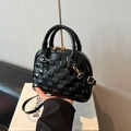 Glossy black patent leather shell handbag with woven pattern and gold hardware - Black
