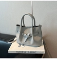 Close-up of light gray woven bucket bag with dual handles and detachable shoulder strap - No Pendant / Gray