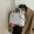 Silver shell handbag with plaid embossed pattern and golden hardware strap details - Silver