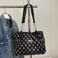 Plaid tweed bucket bag with fringe trim and metal chain shoulder strap for women - Black
