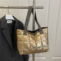 Quilted gold puffer tote bag with geometric ethnic strap and metallic fiber finish - Gold