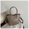 Detail of khaki leather bucket bag with top handles, crossbody strap and Fashion logo - Khaki