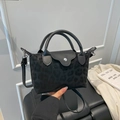 Fashionable black leopard print crossbody bag with dual handles and flap snap closure - Flap Handheld Style / Black Leopard