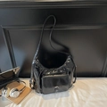 Glossy black patent leather hobo bag with adjustable strap and front pocket - Black