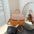 Brown contrast stitch saddle bag with brown fabric panel and golden U-shaped buckle - Brown