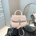 Minimalist beige contrast saddle bag with woven leather texture and horseshoe buckle - Khaki
