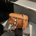 Retro brown square crossbody bag with silver zipper and unique robot charm accessory - Brown