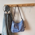 Blue denim style hobo shoulder bag with adjustable brown strap and fashion metal logo - Blue