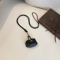 Mini-Kopfhörertasche aus schwarzem Leder mit goldenem Knopf und langem Halsband - Schwarz
