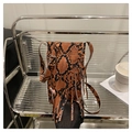 Brown and black faux snakeskin crossbody bag featuring long fringes and adjustable strap - Orange