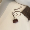 Retro Braune Kopfhörertasche aus Leder mit langem Umhängeband und goldenem Knopf - Braun
